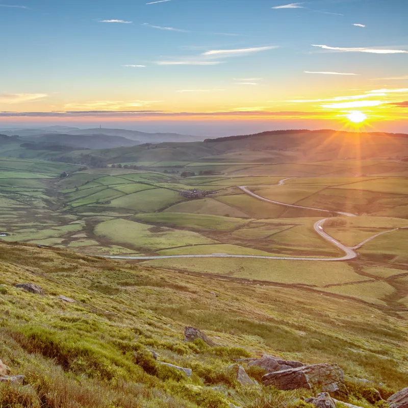 Overlooking hills and a sunset